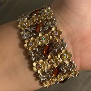 Gold flower bracelet.